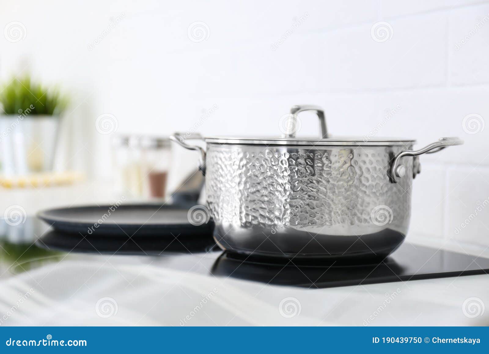Shiny Saucepan on Stove in Kitchen Stock Photo Image of home, indoors