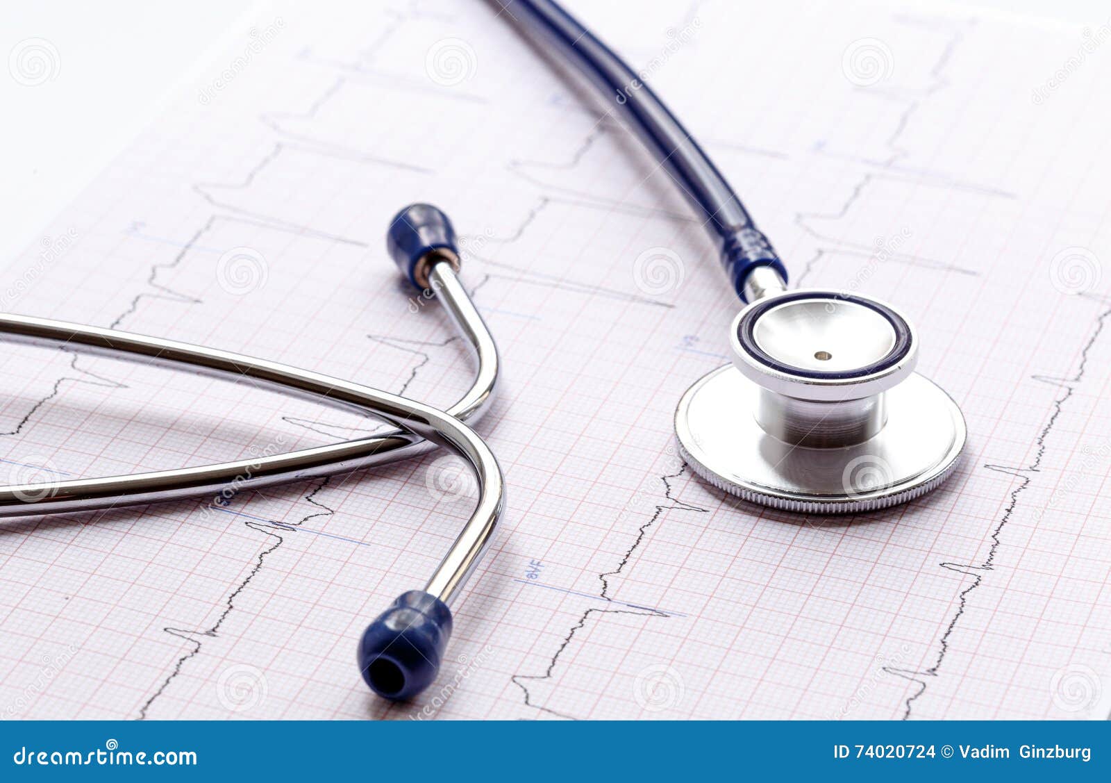 New Stethoscope on a White Background with Cardiogram Isolated Stock