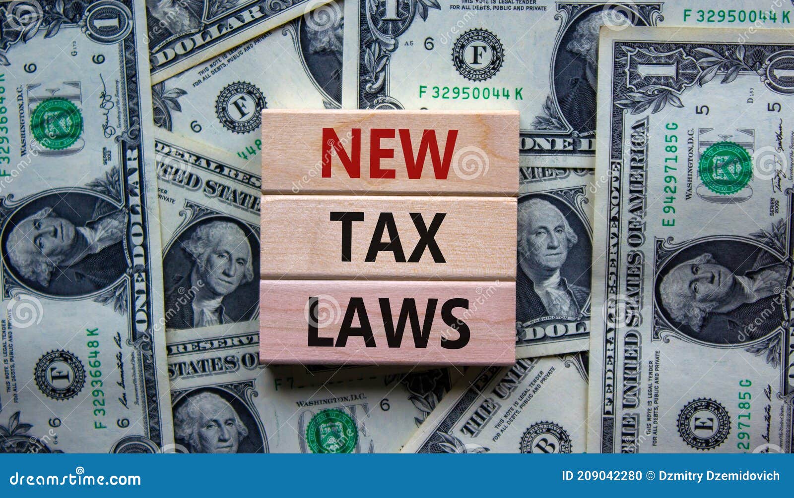new tax laws . concept words 'new tax laws' on wooden blocks