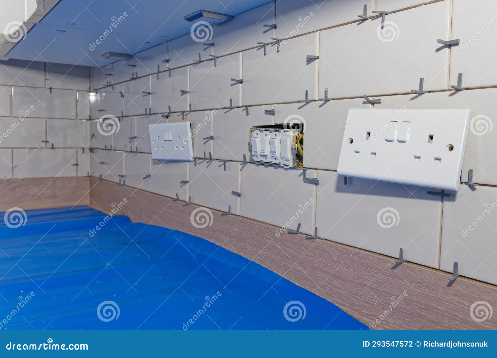 New Tile Installation in Kitchen with Electrical Sockets Removed Stock
