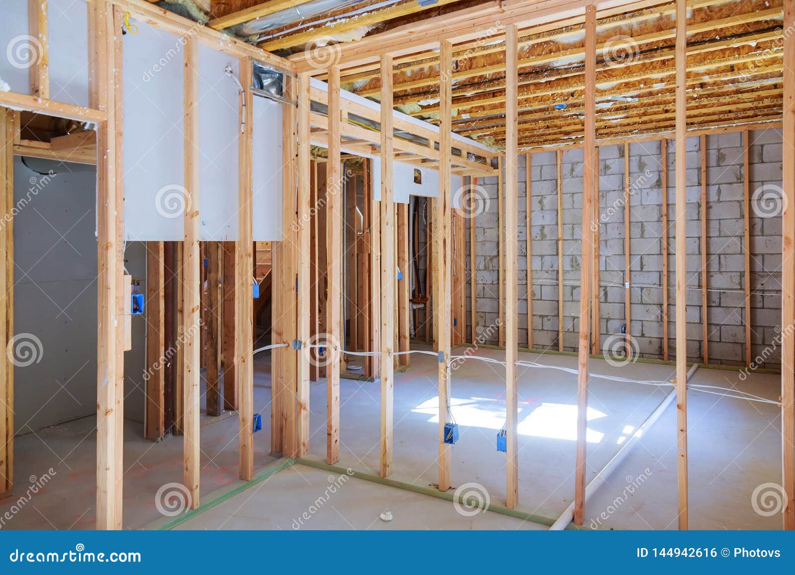 new residential construction home framing with basement view