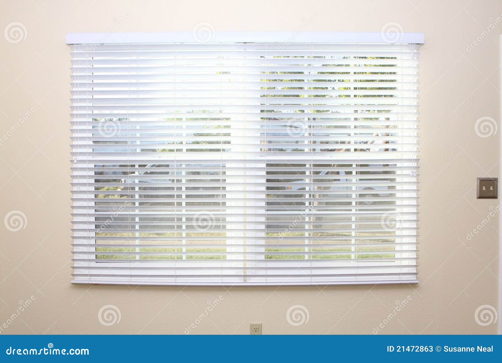 New window blinds on interior wall