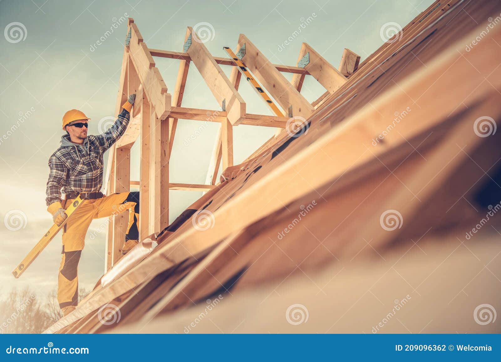 new wooden house construction worker