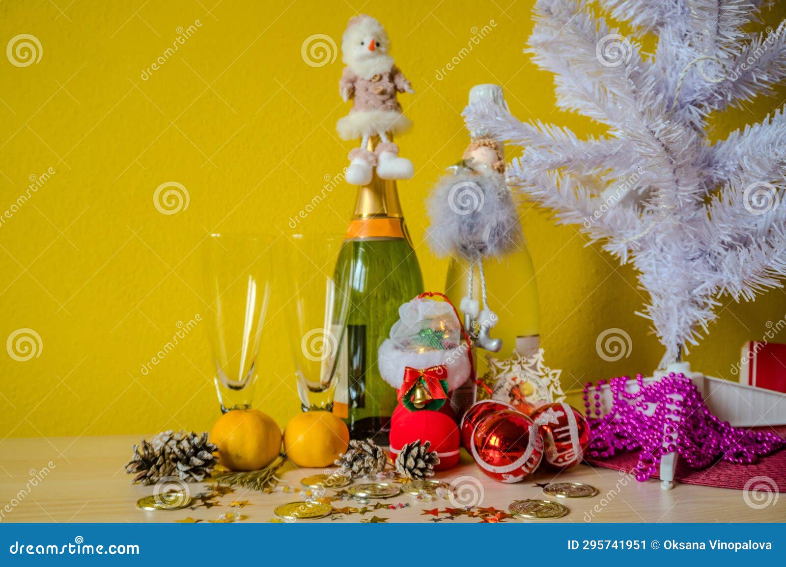 new year background with toy, champagne and tangerines. christmas celebration