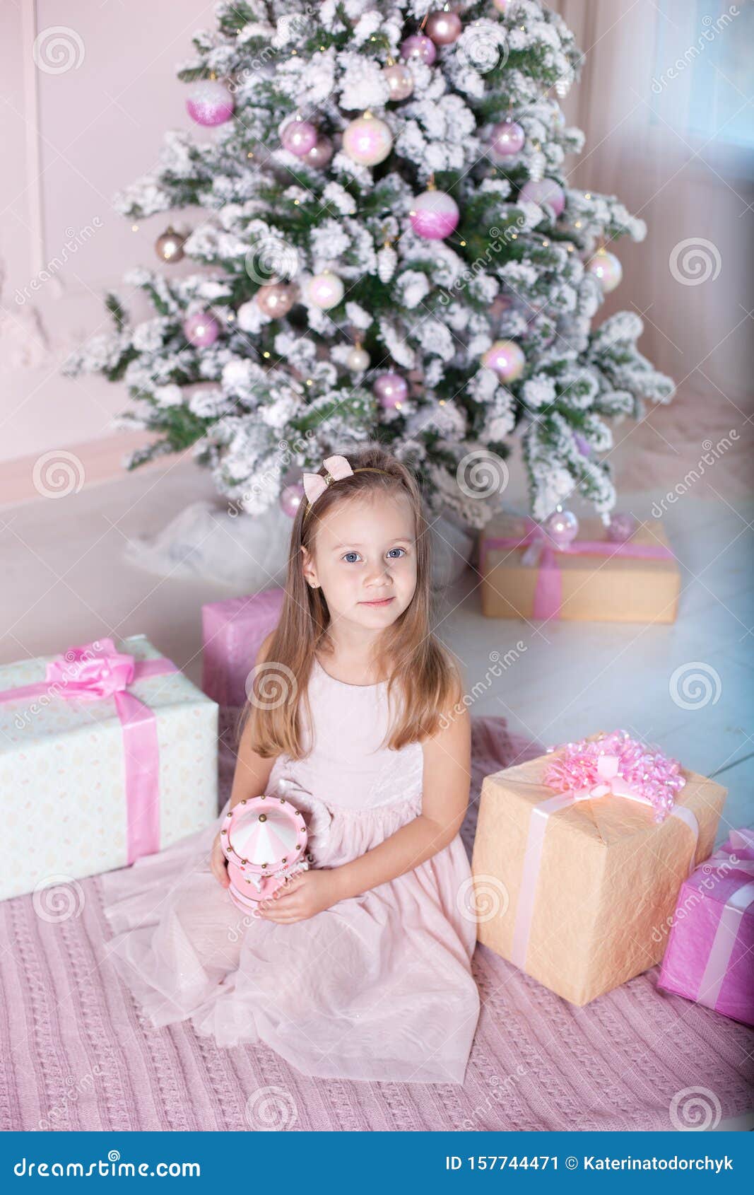 New Year 2020! The Concept Of Christmas, Holidays And Childhood. A Little Girl In A Pink Dress ...