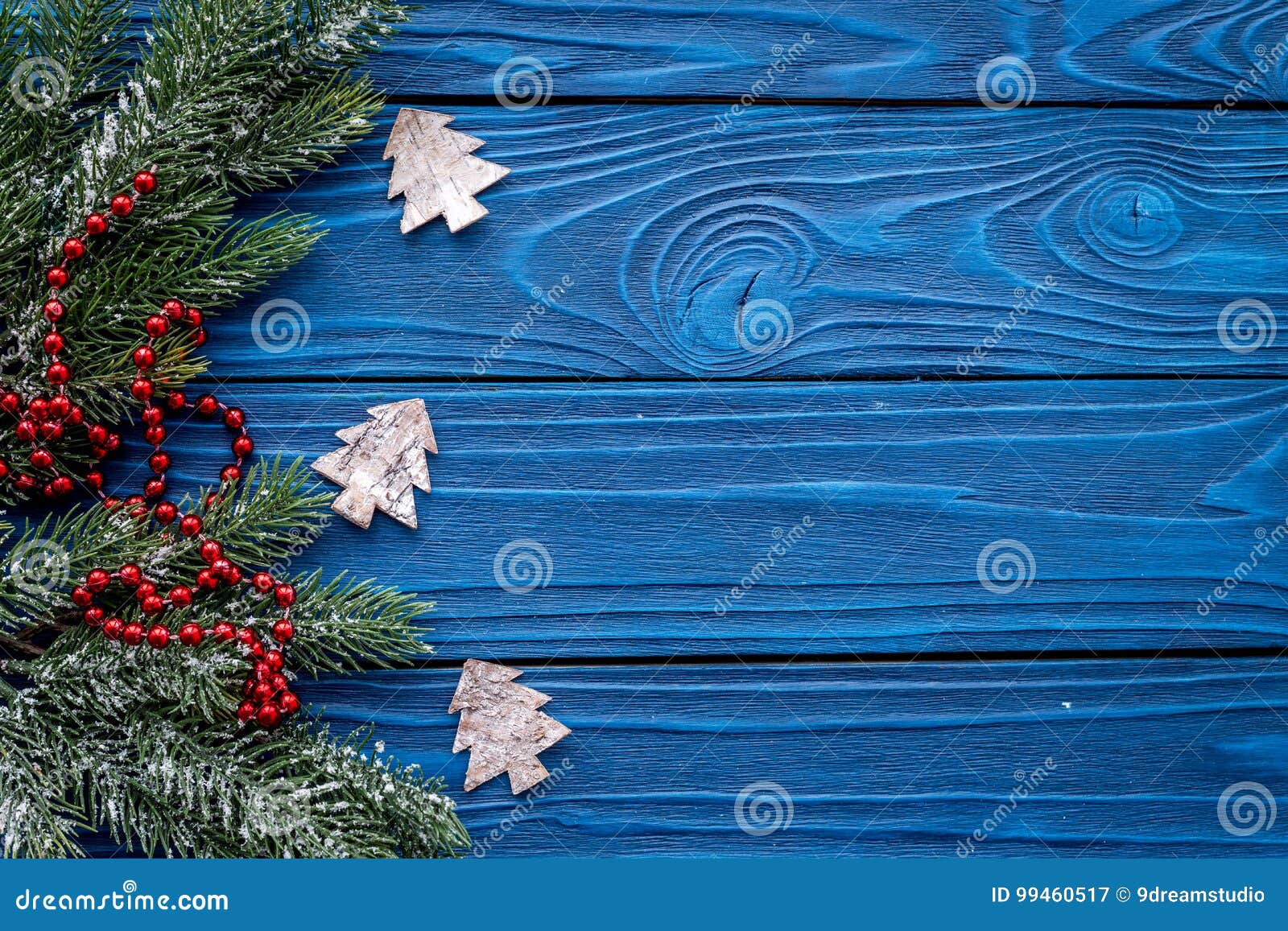 New Year Decorations with Toys and Christmas Tree Branche on Blue ...