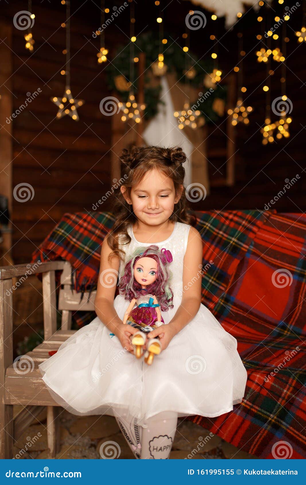 New Year 2020. Merry Christmas, Happy Holidays. A Little Girl Sitting On Bench And Hold Doll In ...