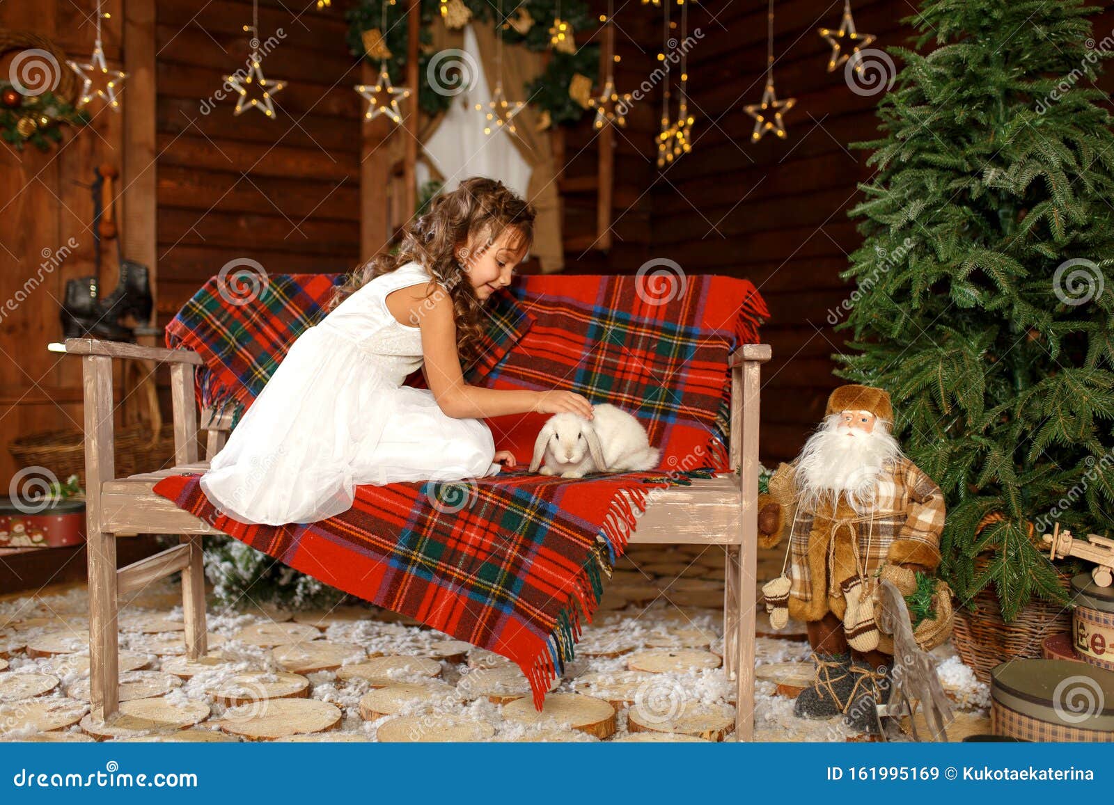 New Year 2020. Merry Christmas, Happy Holidays. A Little Girl In White Dress Sitting On The ...