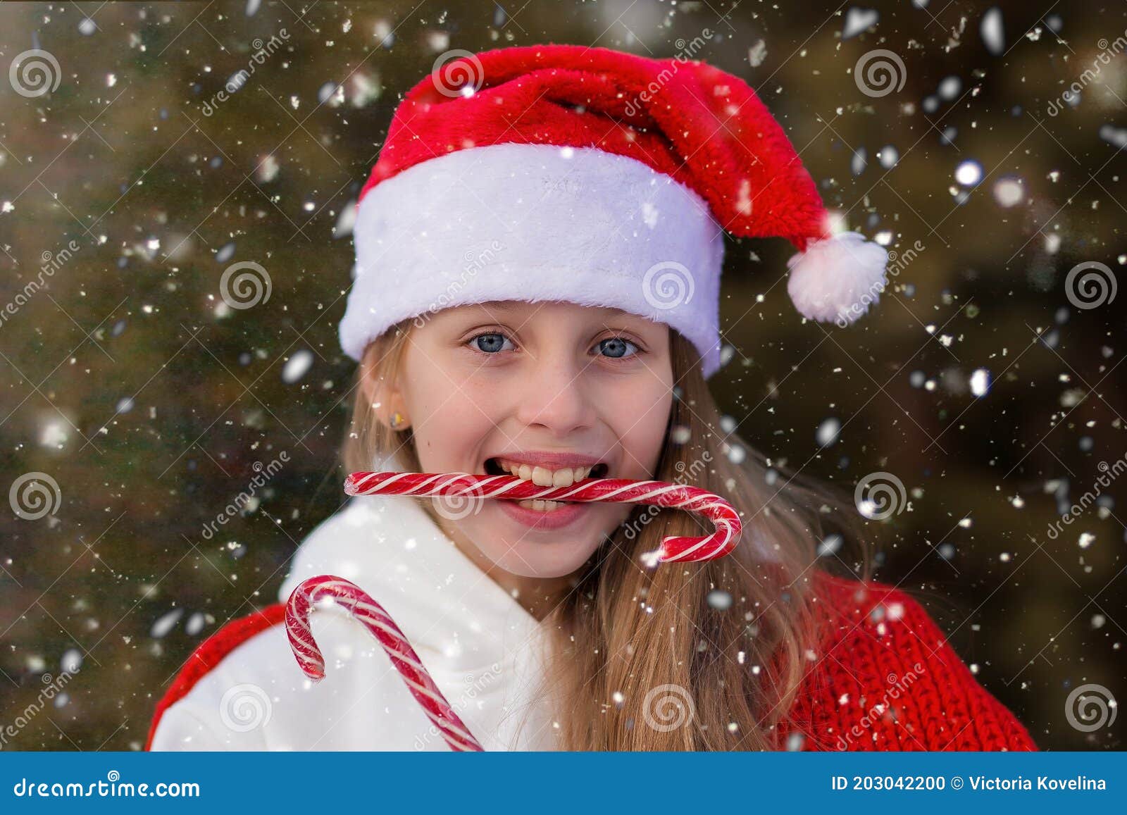 New Year`s Portrait of a Cute Girl in a Cap Outdoors. Playful Girl with ...