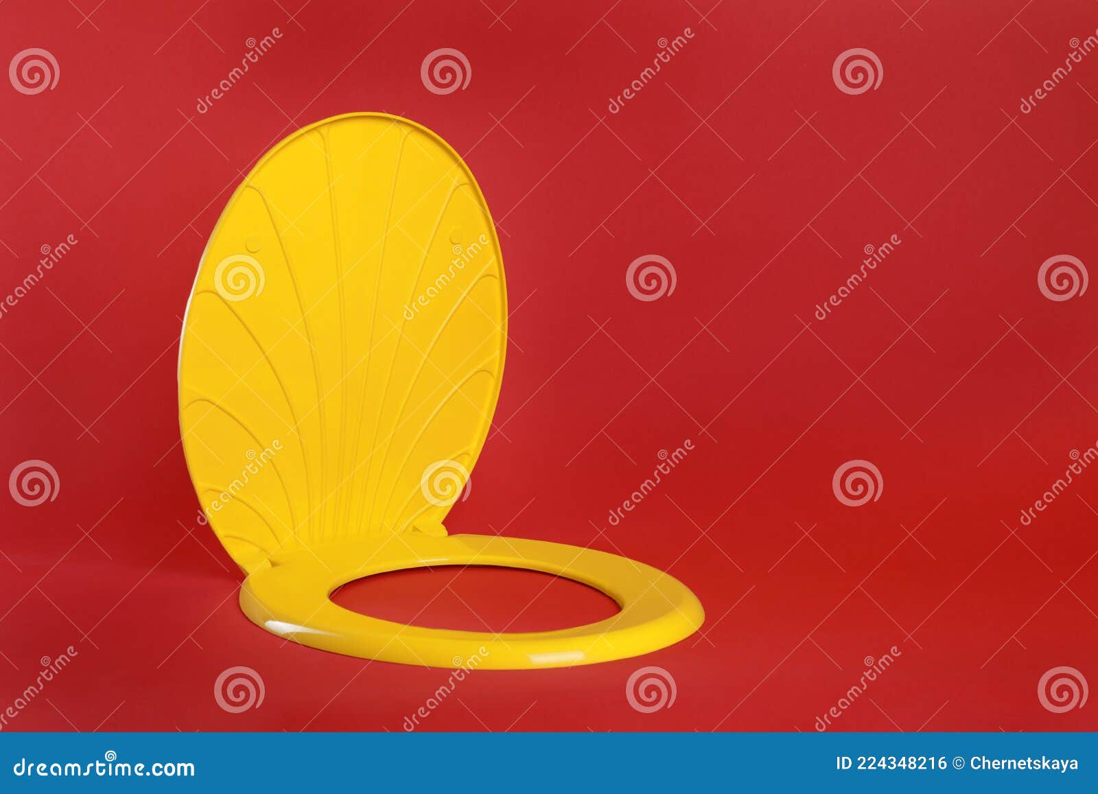 New Yellow Plastic Toilet Seat on Red Background, Space for Text Stock Photo Image of
