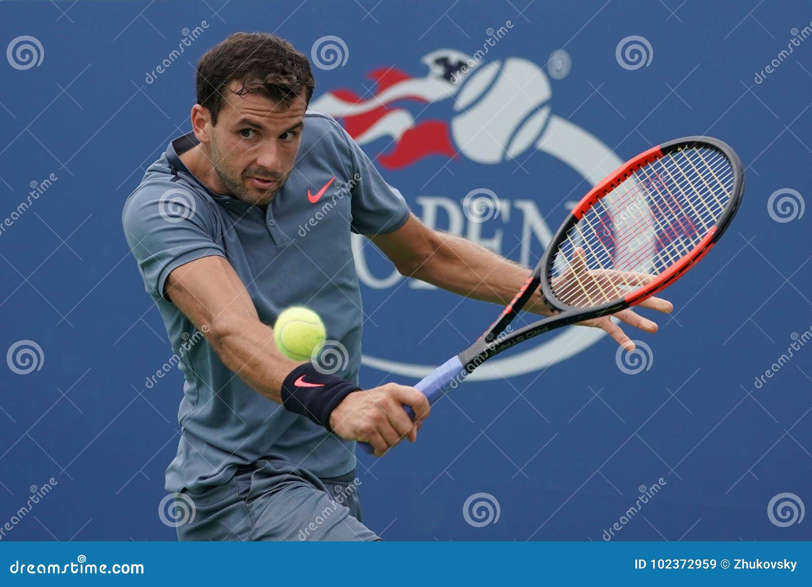 NEW YORK - AUGUST 31, 2017: Professional tennis player Grigor Dimitrov of Bulgaria in action during his US Open 2017 second round match at Billie Jean King National Tennis Center