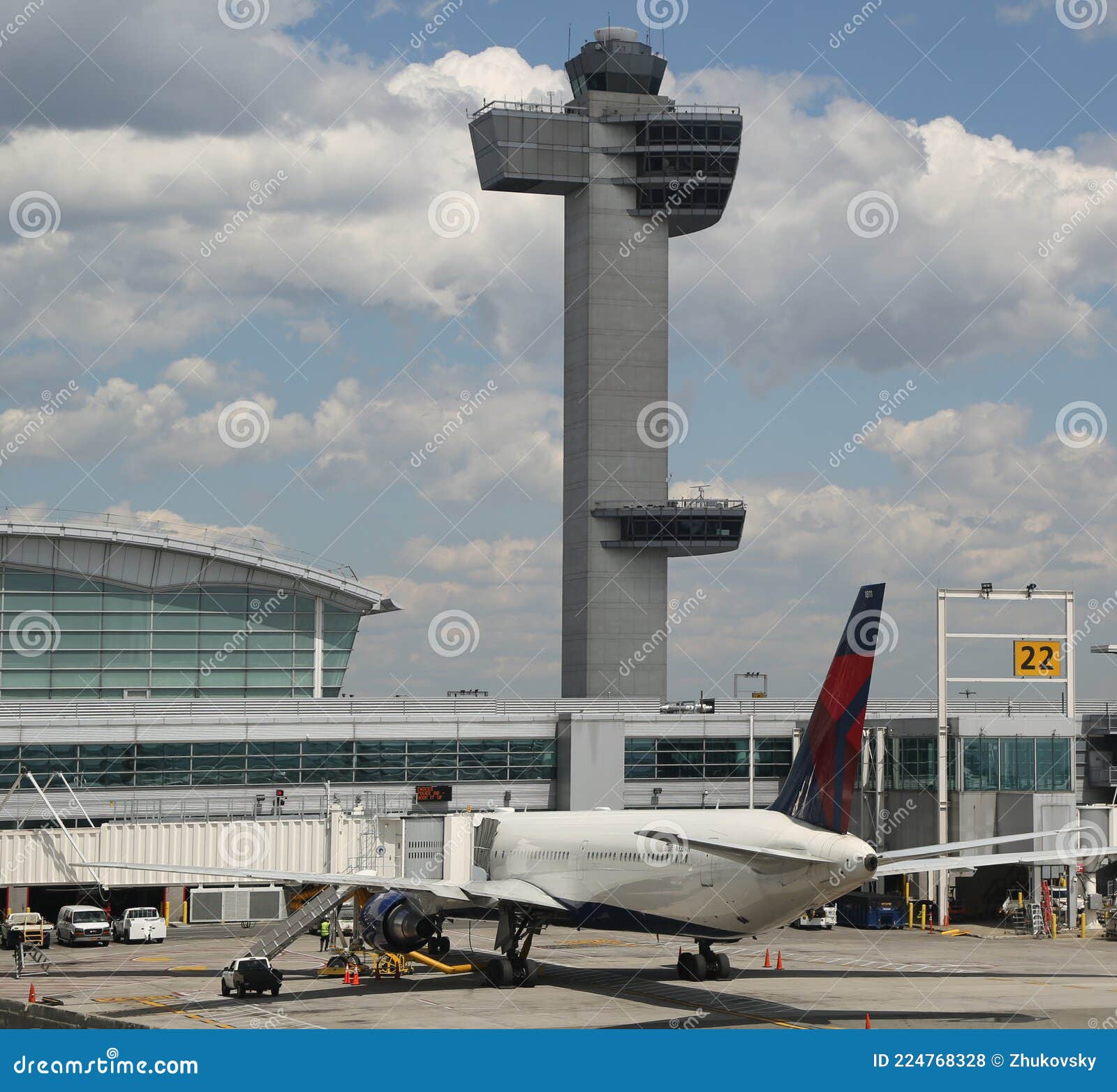 Air Traffic Control Tower And Delta Airlines Plane On Tarmac At