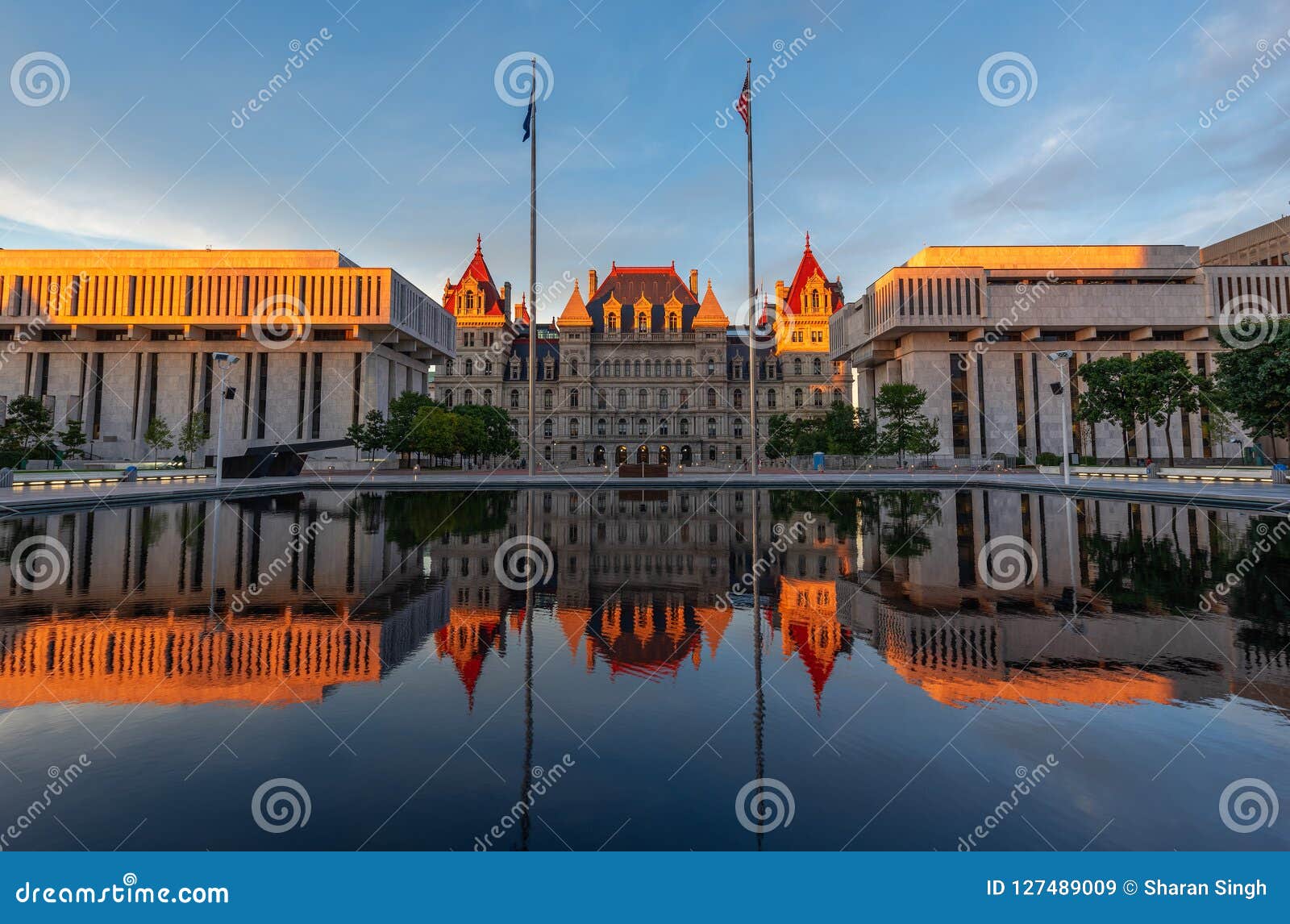 new york state capitol building reflection at sunset, albany, ny, usa