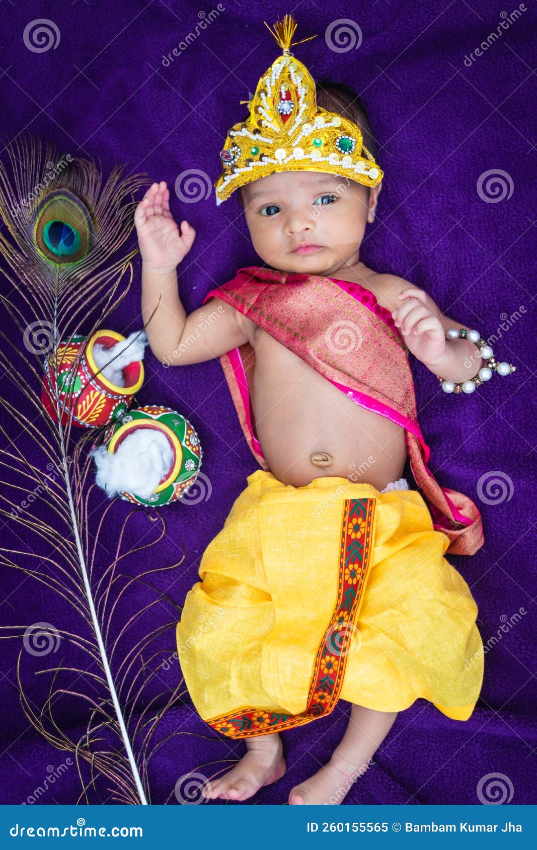 Newborn Baby Boy in Krishna Dressed with Props from Unique Perspective