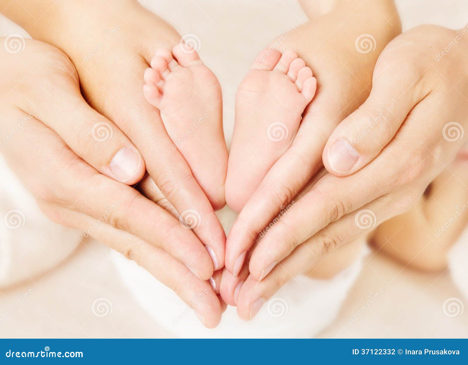 newborn baby feet parents holding in hands.