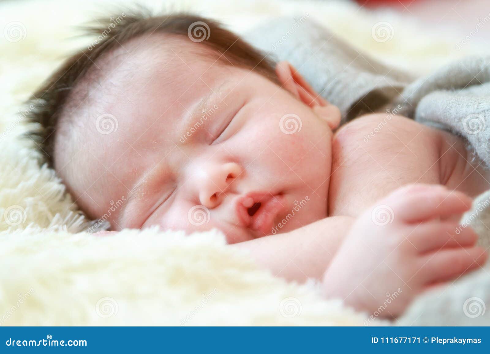 Newborn Baby Girl Smiling in a Dream ,Newborn Baby Girl is Sleep Stock