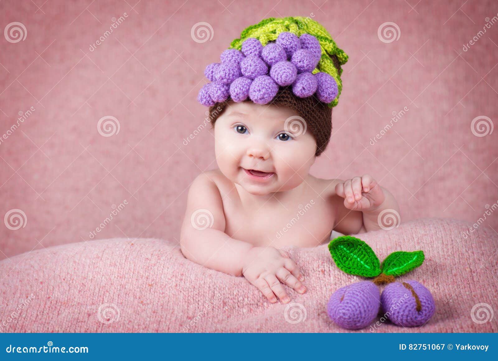 Newborn Baby a Knitted Cap in the Form of Grapes. Stock Image Image