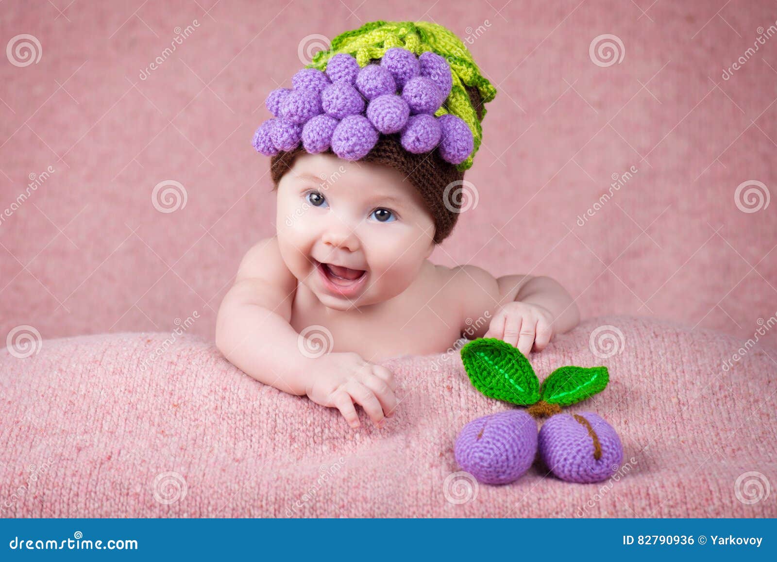 Newborn Baby a Knitted Cap in the Form of Grapes. Stock Photo Image of child, happy 82790936