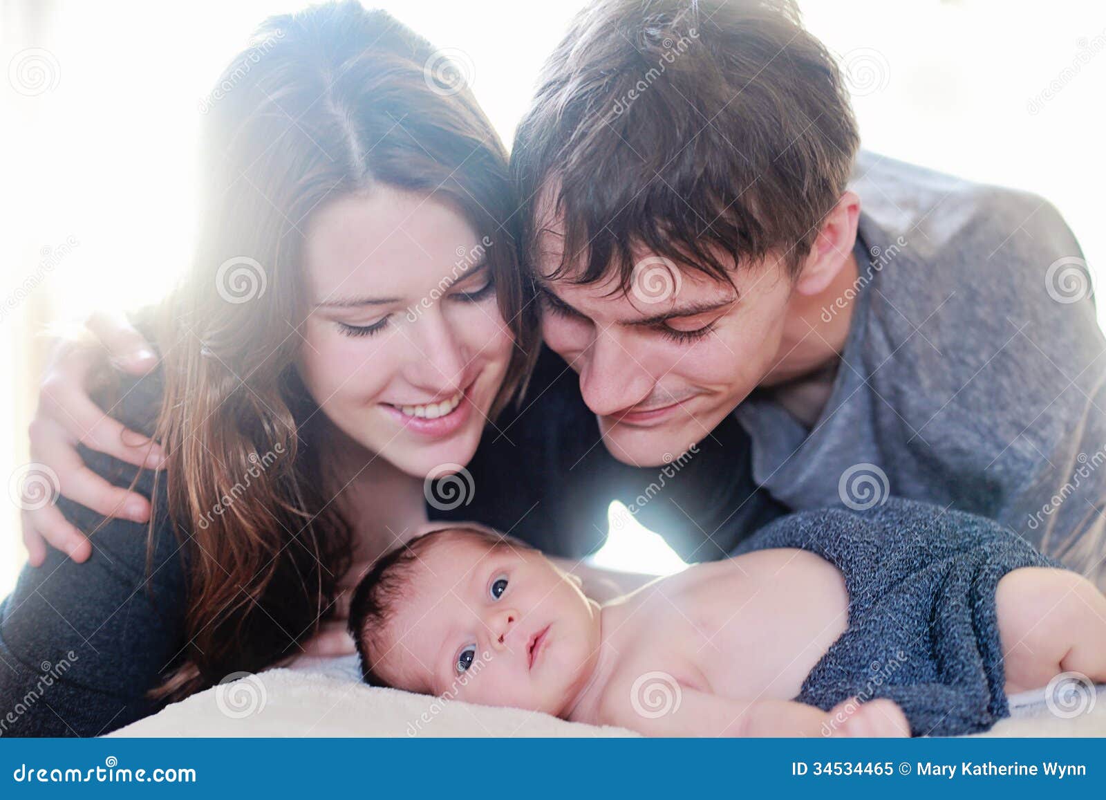 newborn baby meeting parents