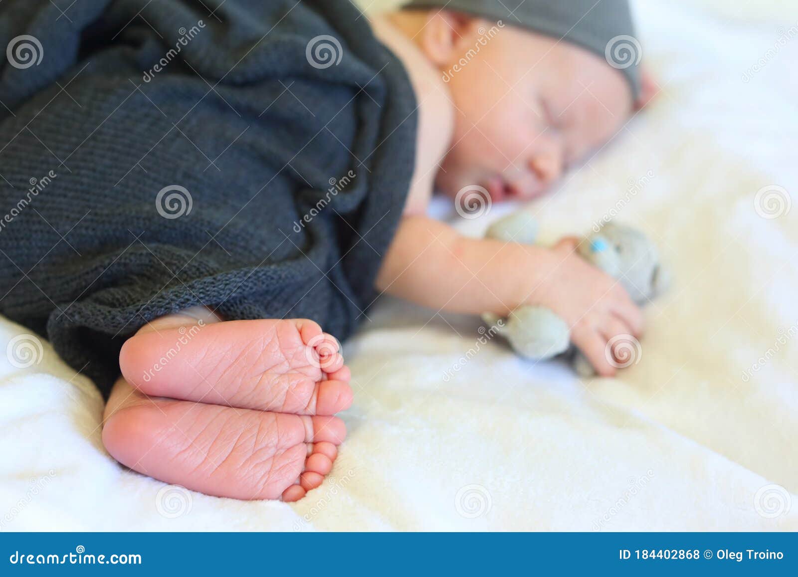 Newborn Baby Sleeping in the Arms of a Toy Stock Photo Image of child