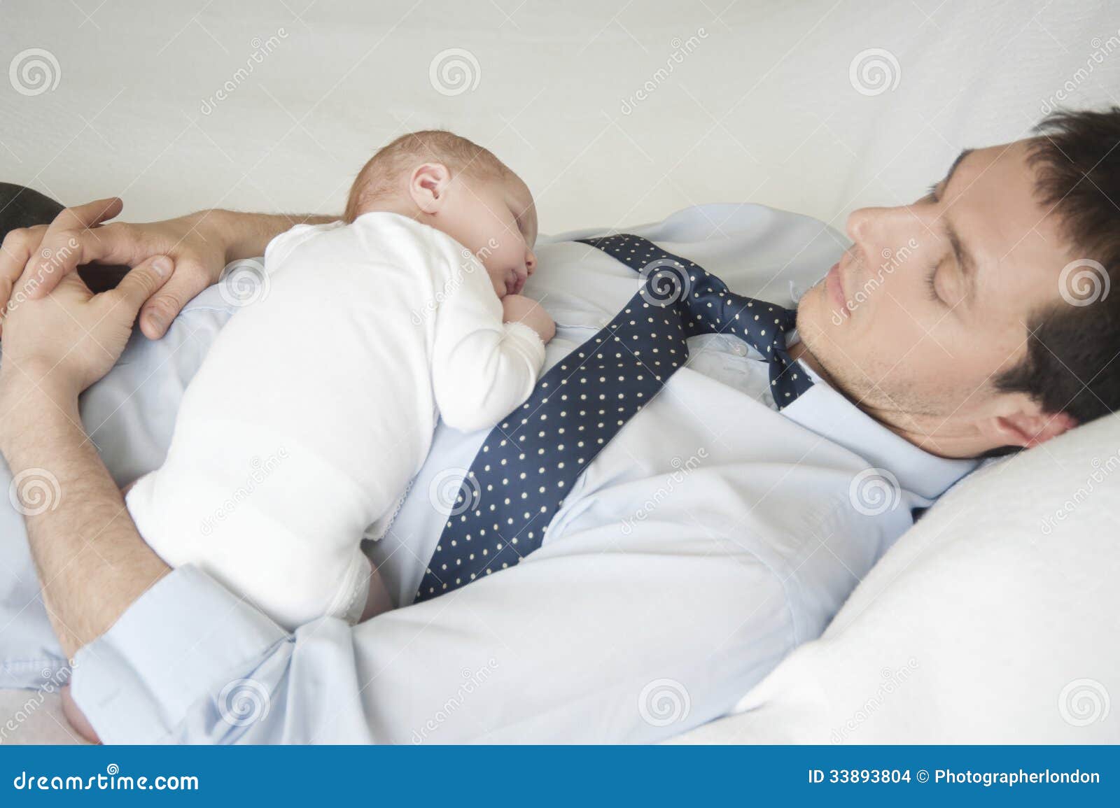 Newborn Baby Sleeping with Father in Bed Stock Photo Image of