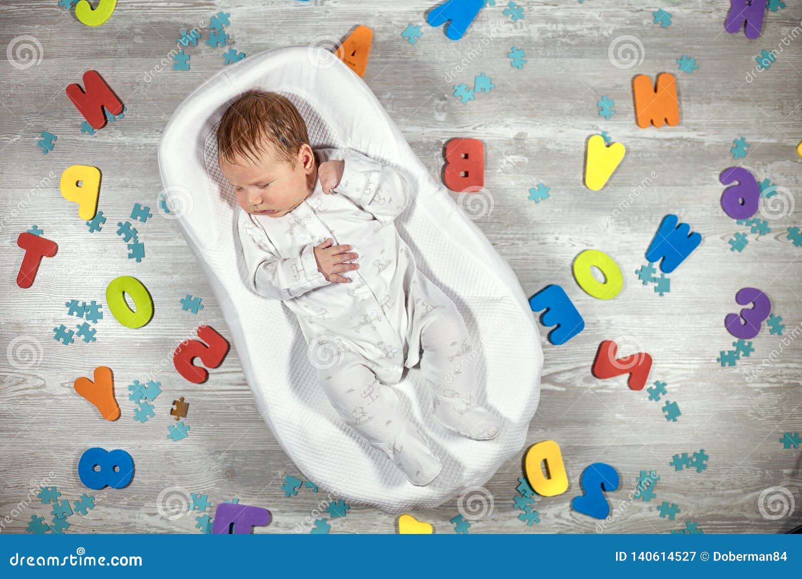 Newborn Baby Sleeps In A Special Orthopedic Mattress Baby Cocoon