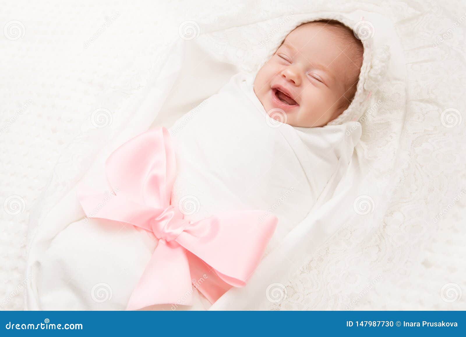Newborn Baby Smile, New Born Girl Smiling Wrapped by Ribbon Bow ...