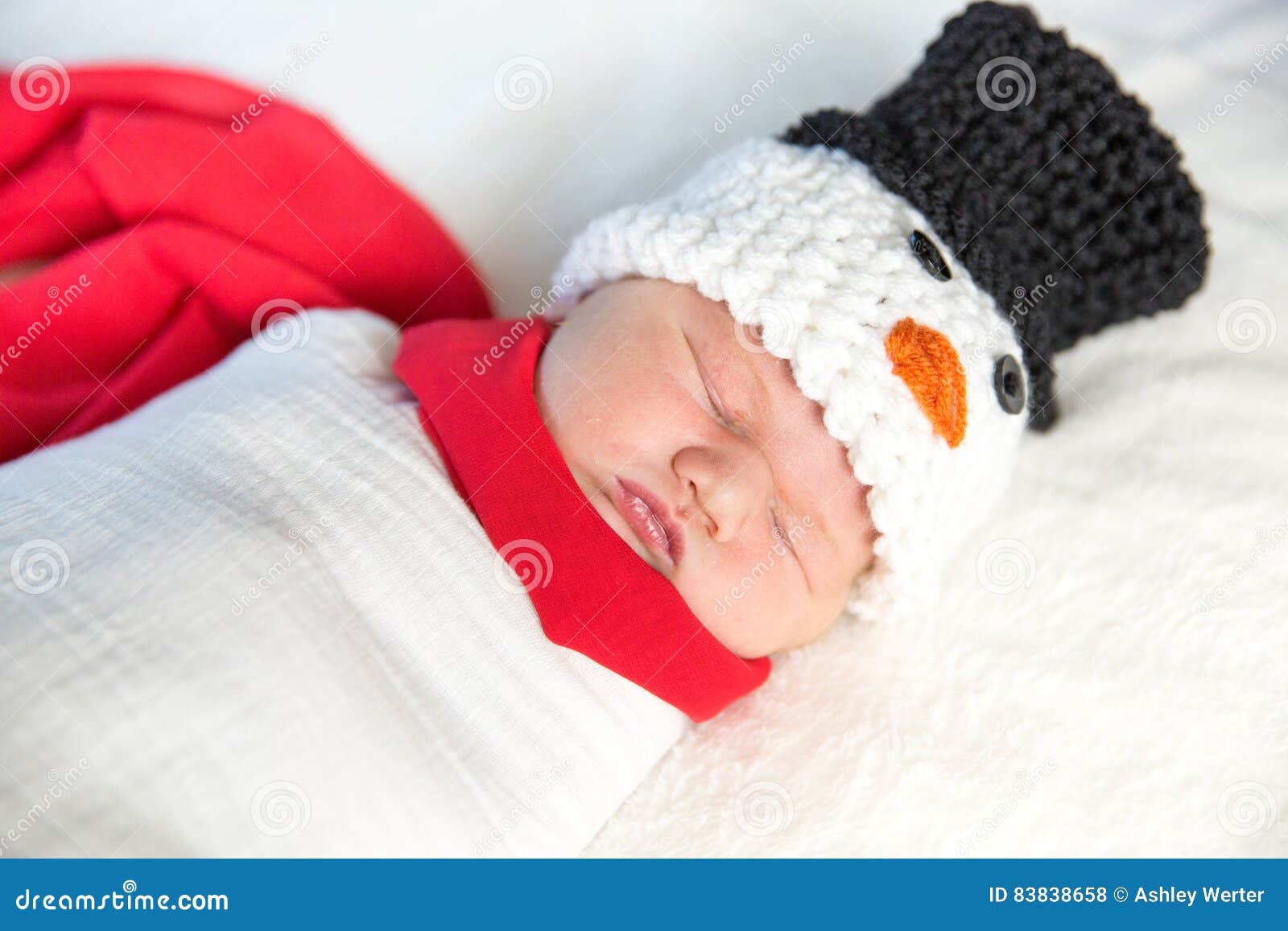 Newborn baby snowman. Brand new baby boy in snowman outfit