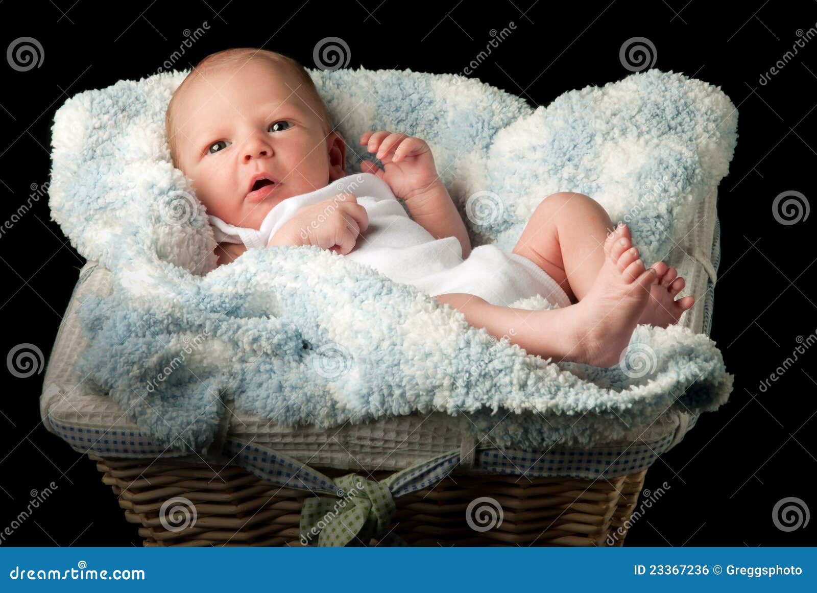 Newborn in a basket stock photo. Image of blanket, child 23367236