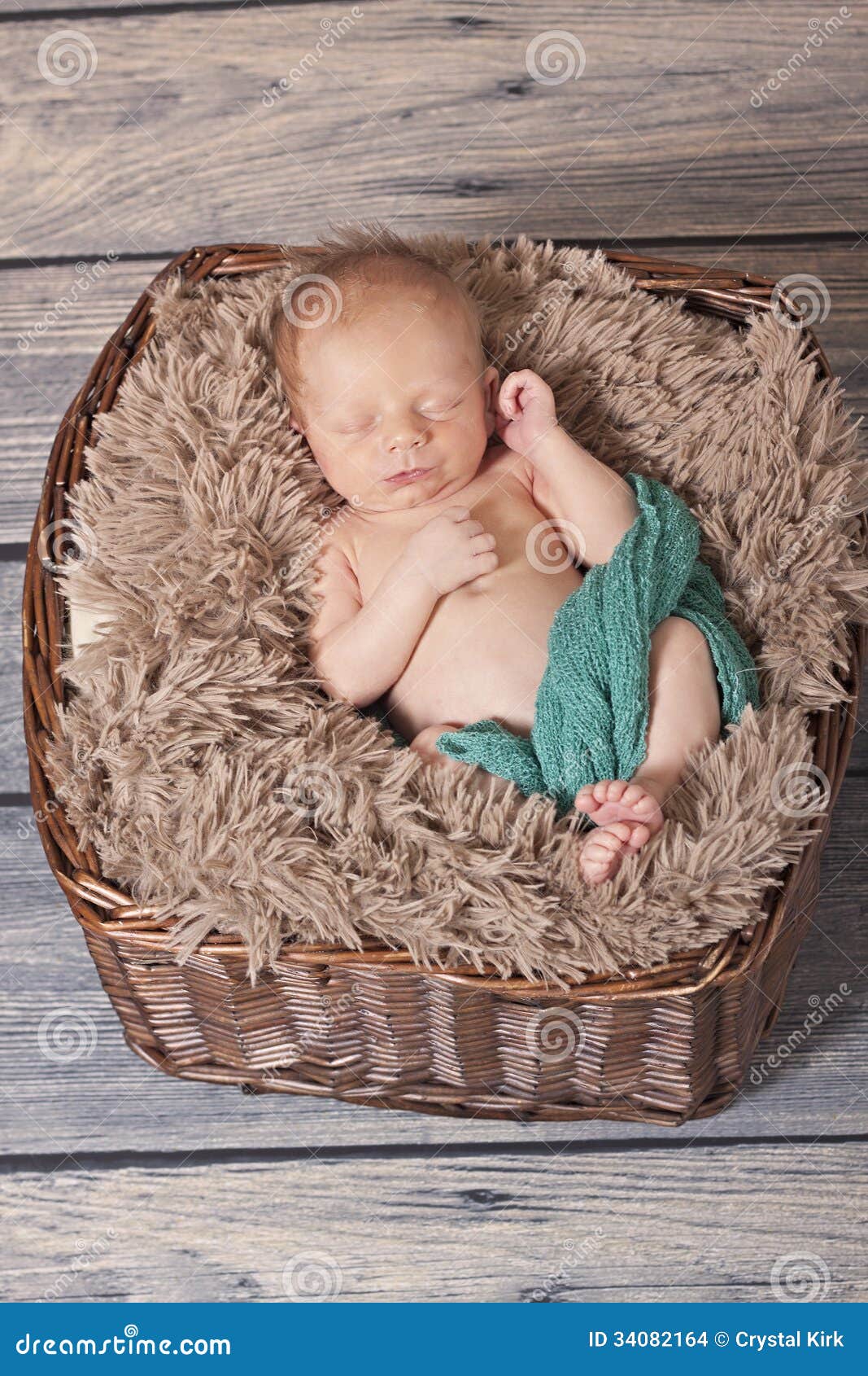 newborn in basket