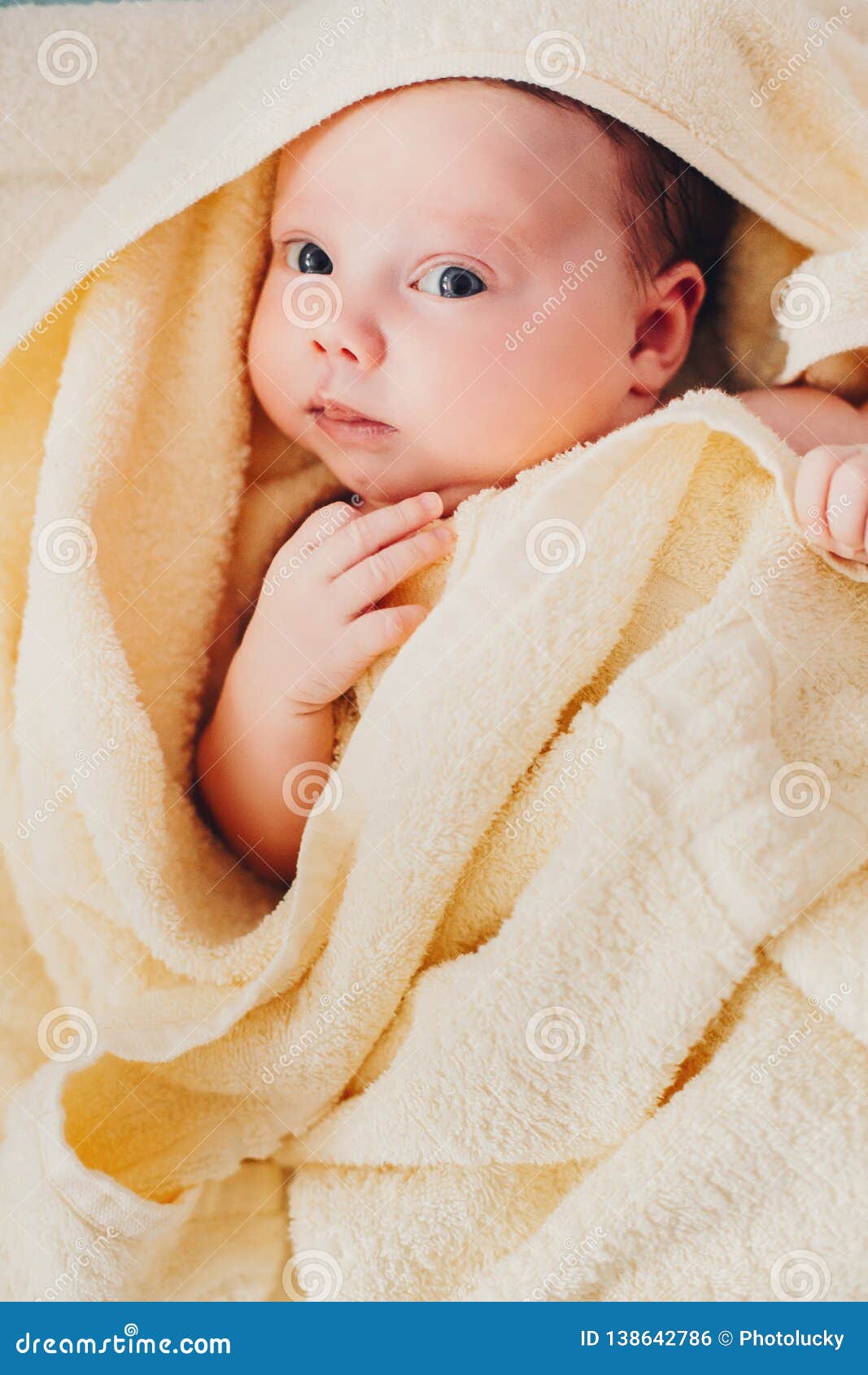 Newborn after Bath Wearing in Towel Lying on Back. Stock Photo - Image ...