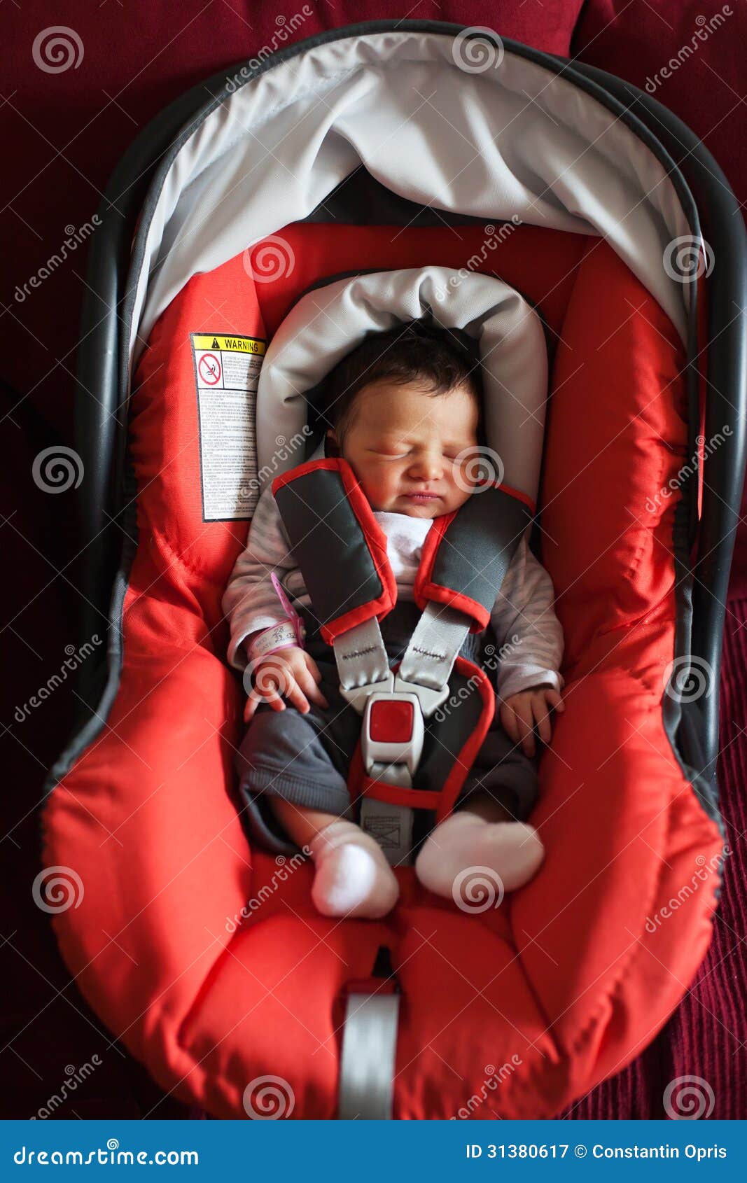 newborn in car safety seat