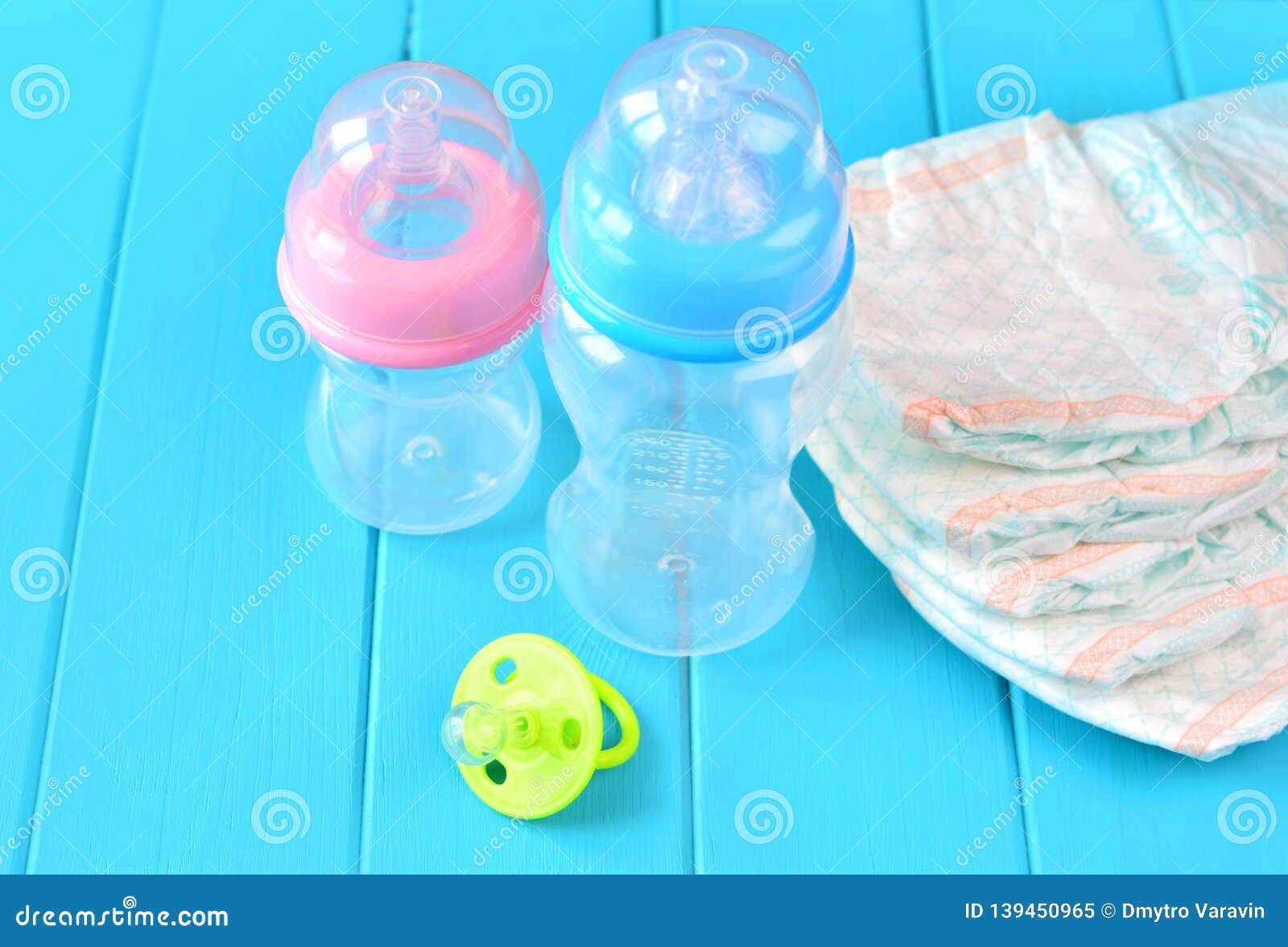 Newborn Child Stuff on a Wooden Background. Stack of Baby Disposable ...