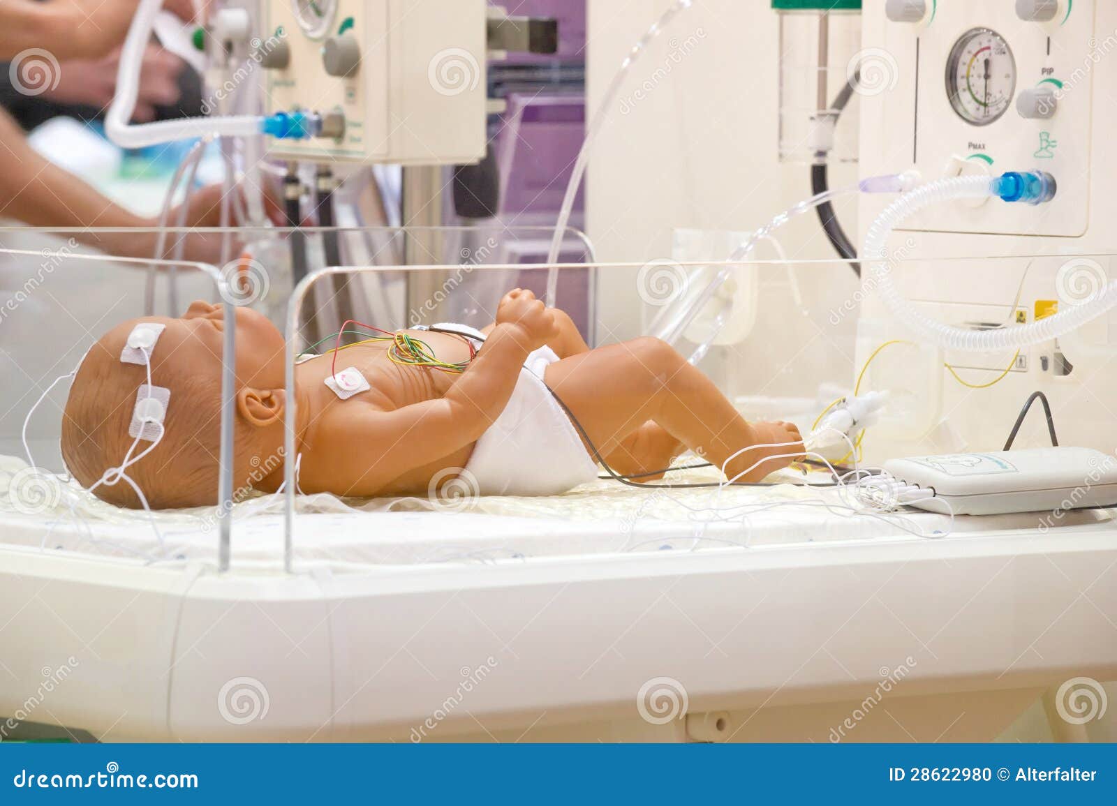 Newborn in a hospital bed stock photo. Image of clinic 28622980