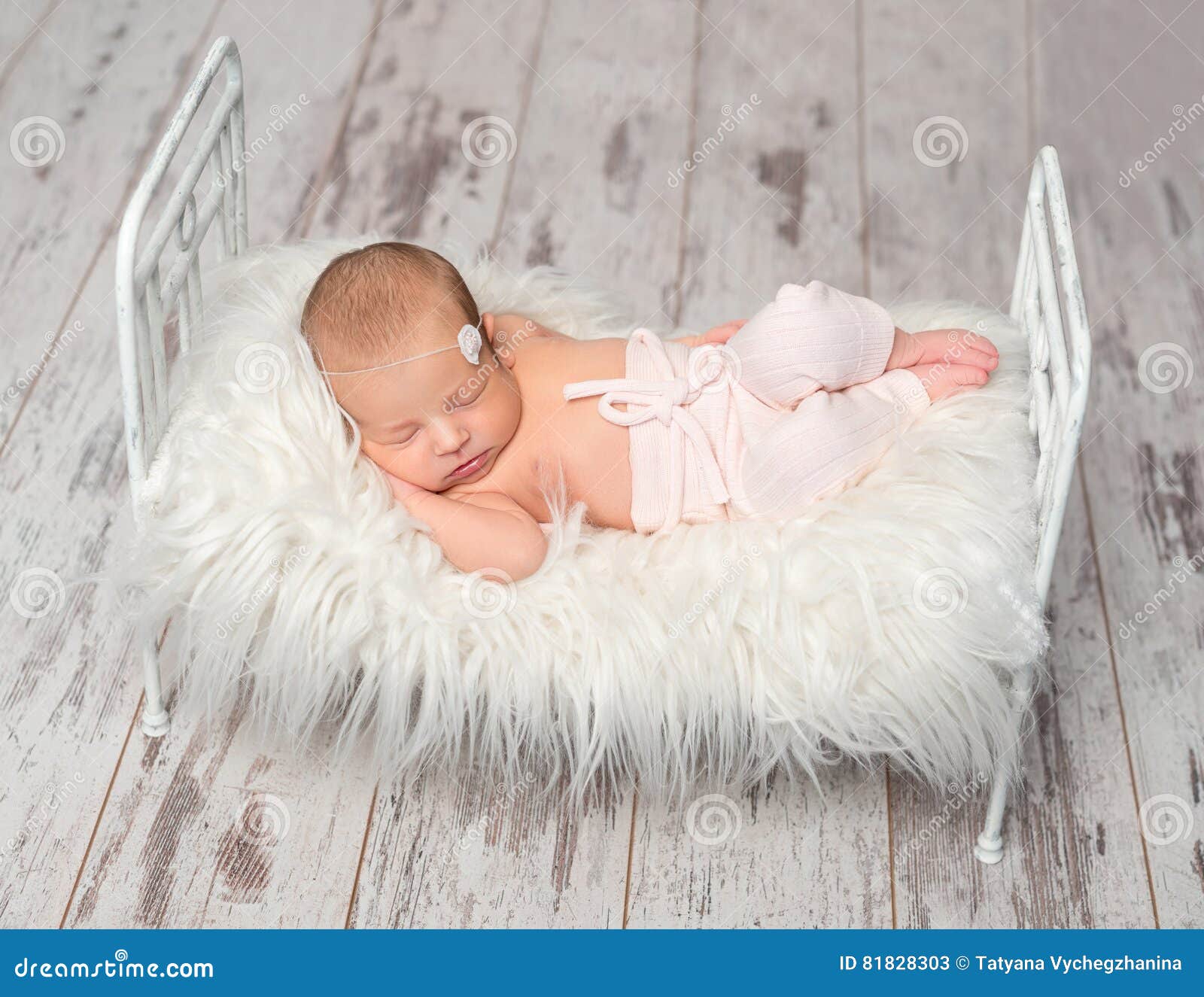 baby holding bed