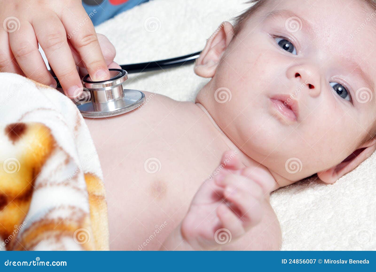 Newborn with stethoscope stock image. Image of illness 24856007