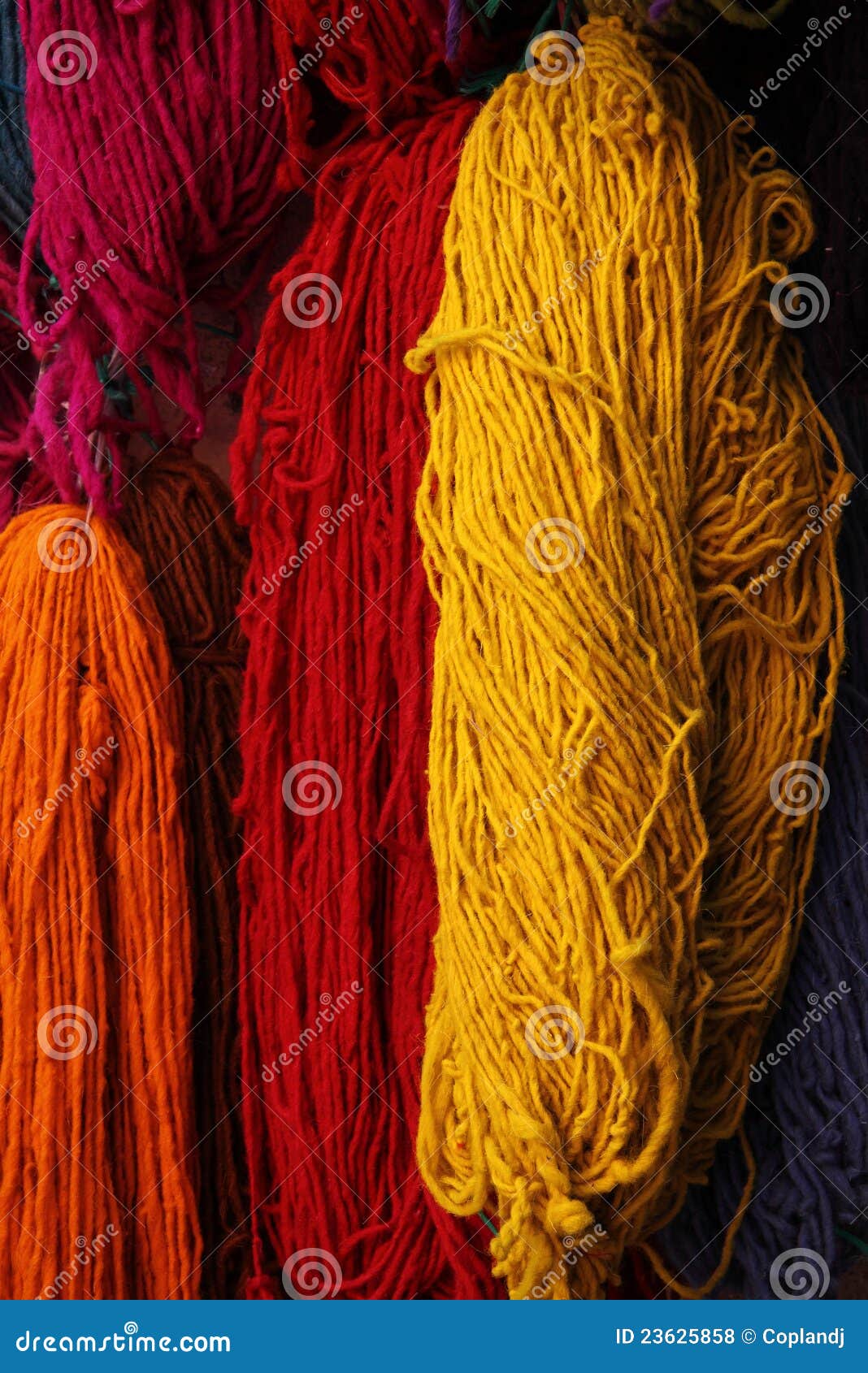 Pink, gray, multicolored yarn of wool in bundles for hand knitting