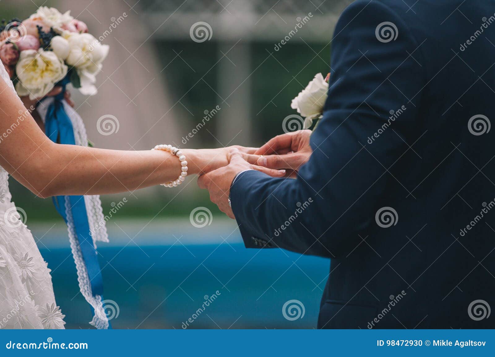 Newlyweds Exchange Rings, Groom Puts the Ring on the Bride`s Hand ...