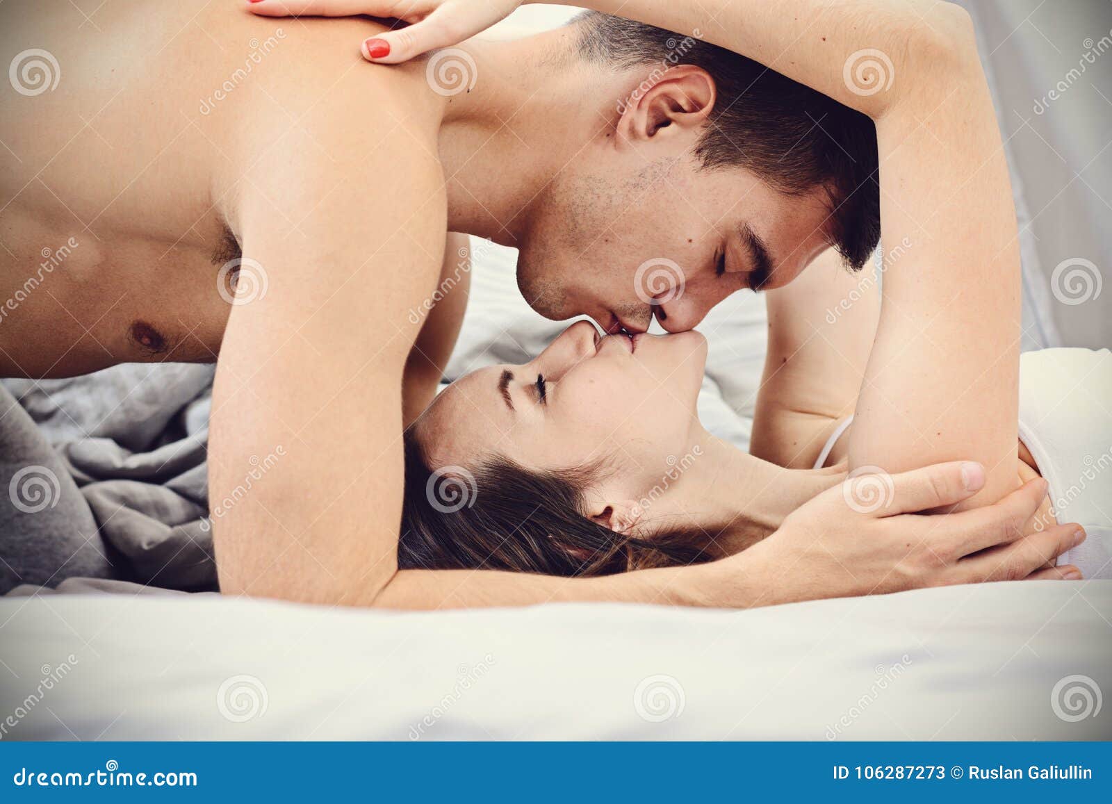 Newlyweds Gently Kissing In Bed In The Early Morning Good Morning