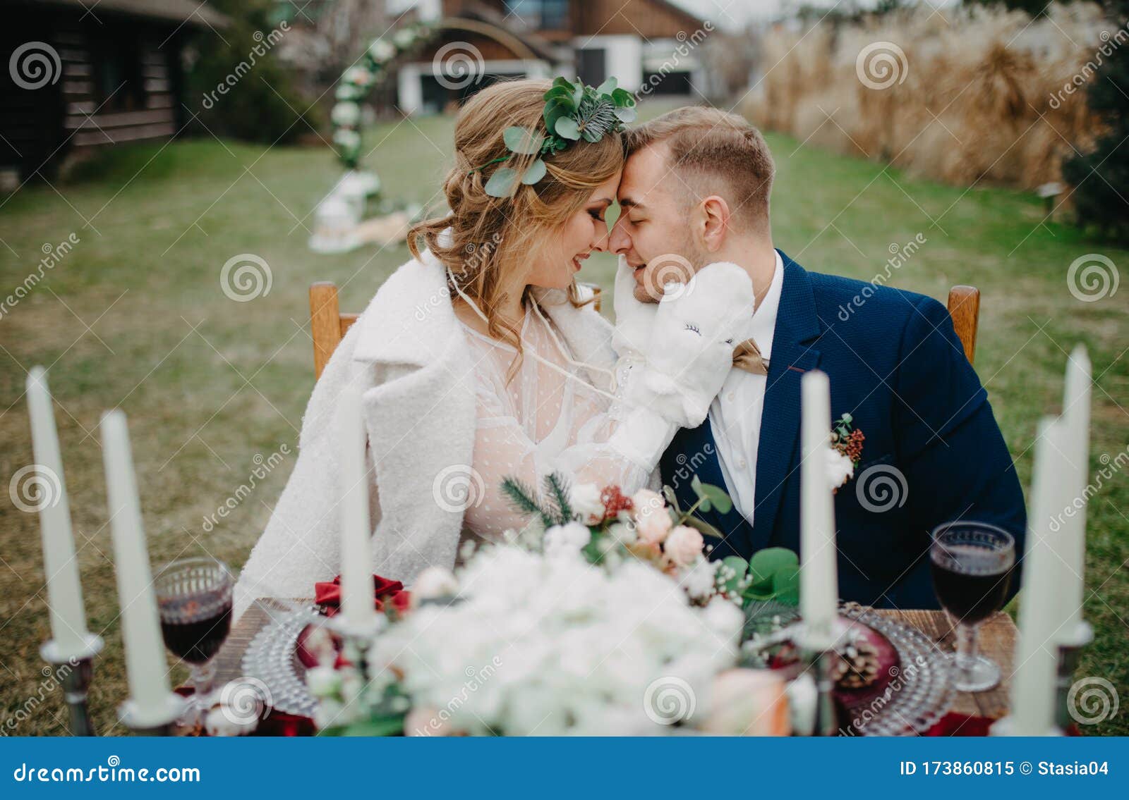 Newlyweds Sit Near Banquet Table And Embrace Stock Image Image Of