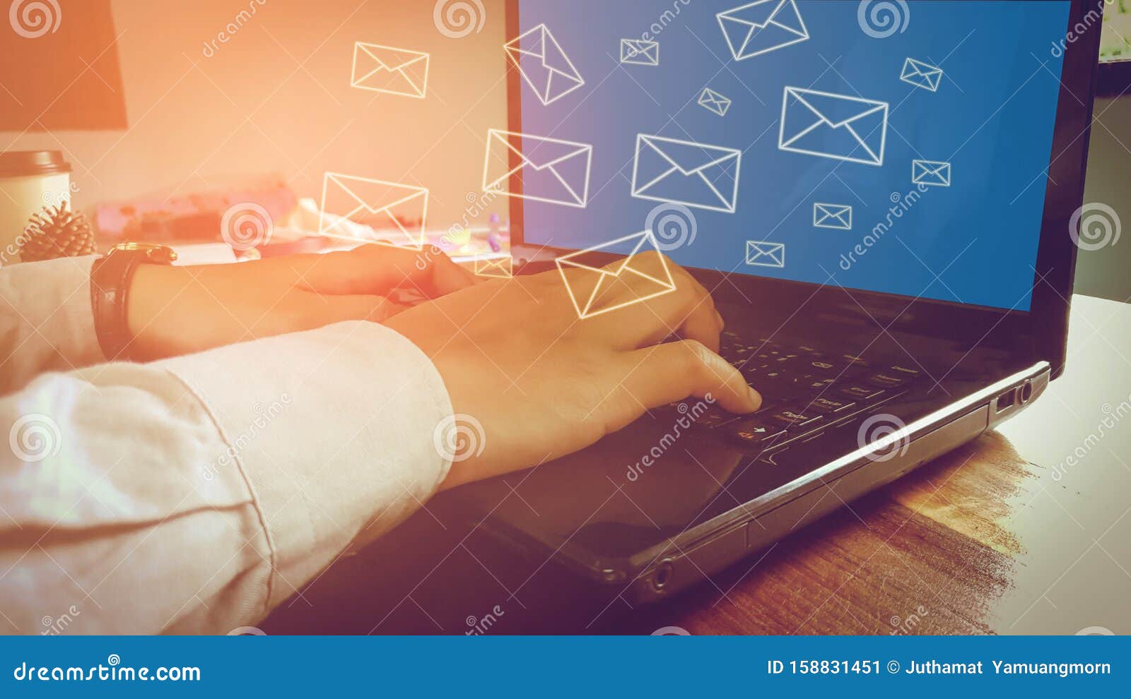 newsletter concept hand of businessman checking message box on digital laptop vintage tone filter