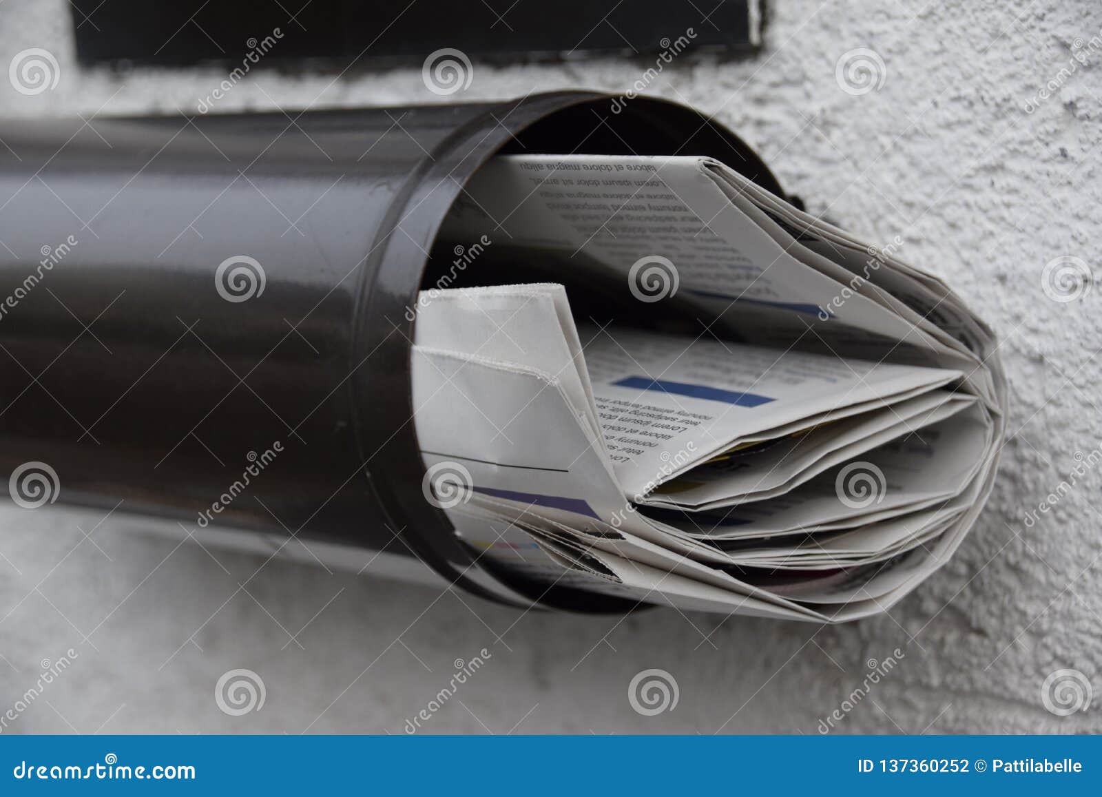Newspapers in a mailbox stock photo. Image of issues 137360252