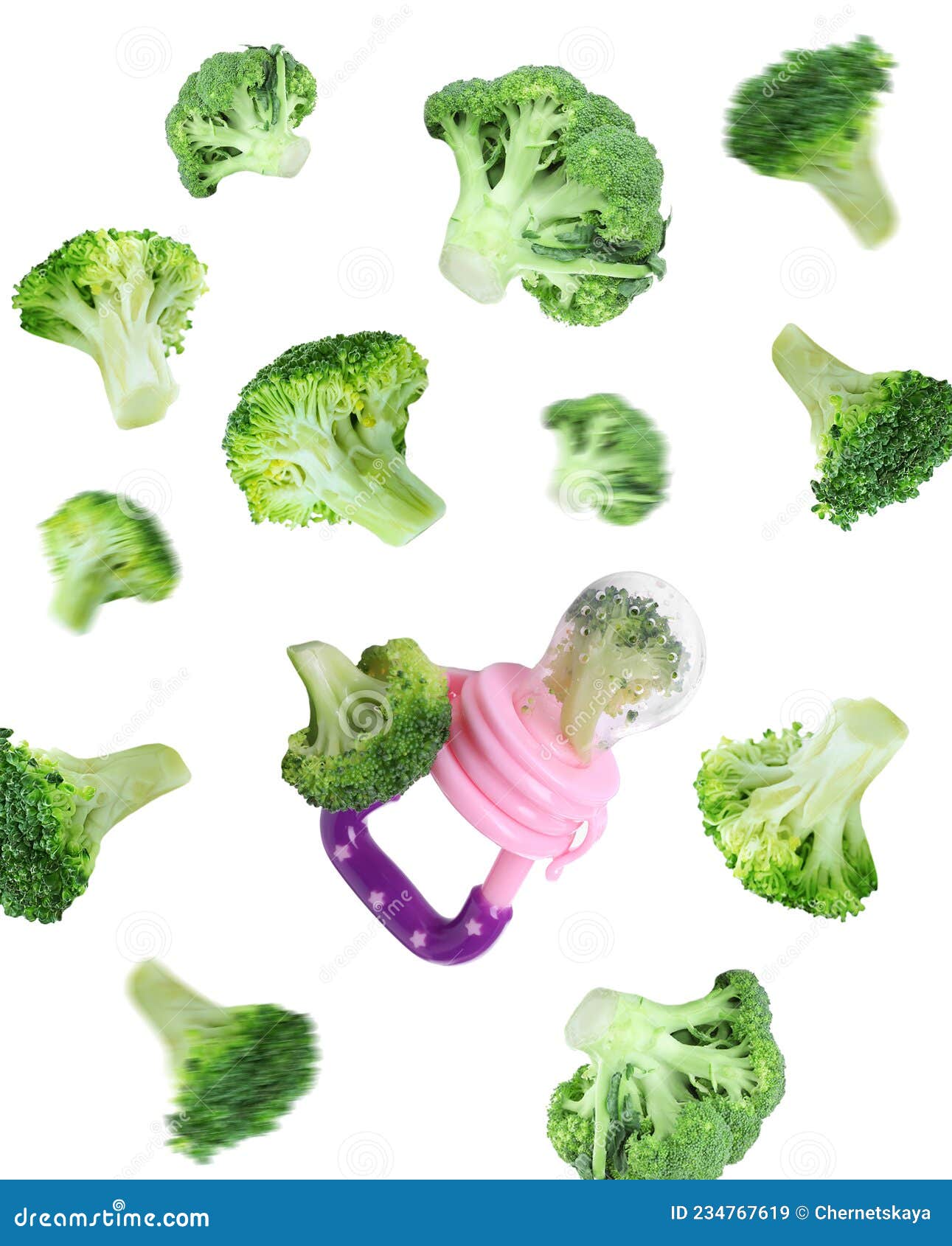 nibbler and  green broccoli falling on white background. baby feeder