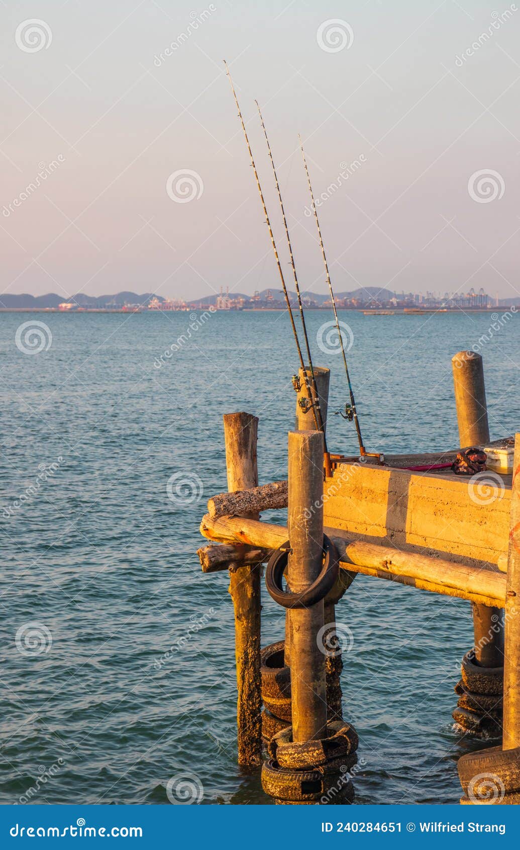 An Angler`s Place with His Fishing Rods Right on the Pier from the Sea  Stock Image - Image of coastline, horizon: 240284651