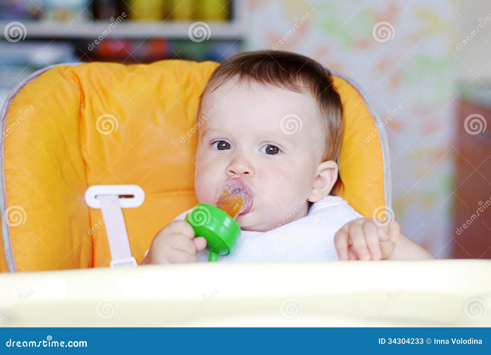 nice baby eats fruits by using nibbler