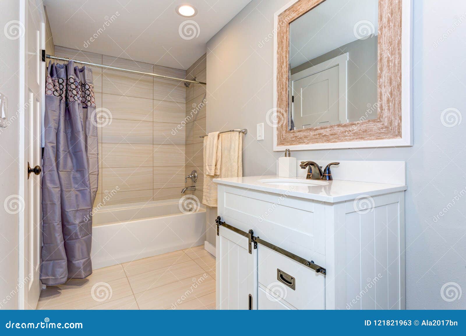 nice bathroom interior with a vanity cabinet.