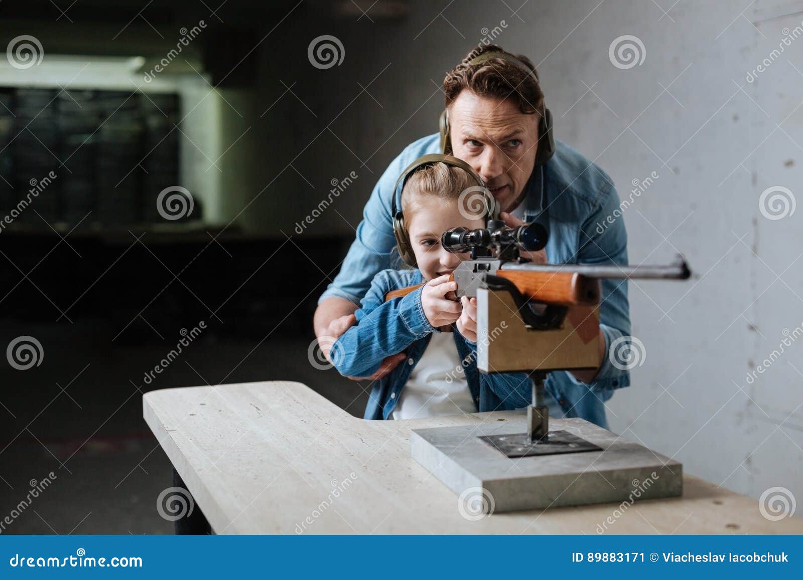 Nice Delighted Father and Daughter Visiting the Shooting Range Stock ...