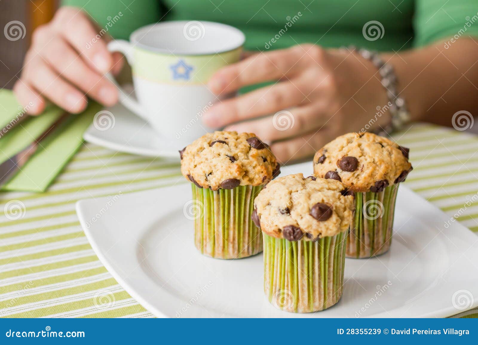 Nice Girl with a Cup and Chocolate Chip Muffin at Breakfast Stock Image