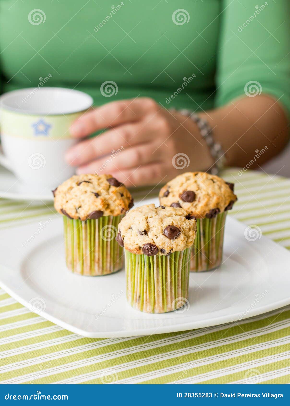 Nice Girl with a Cup and Chocolate Chip Muffin at Breakfast Stock Image