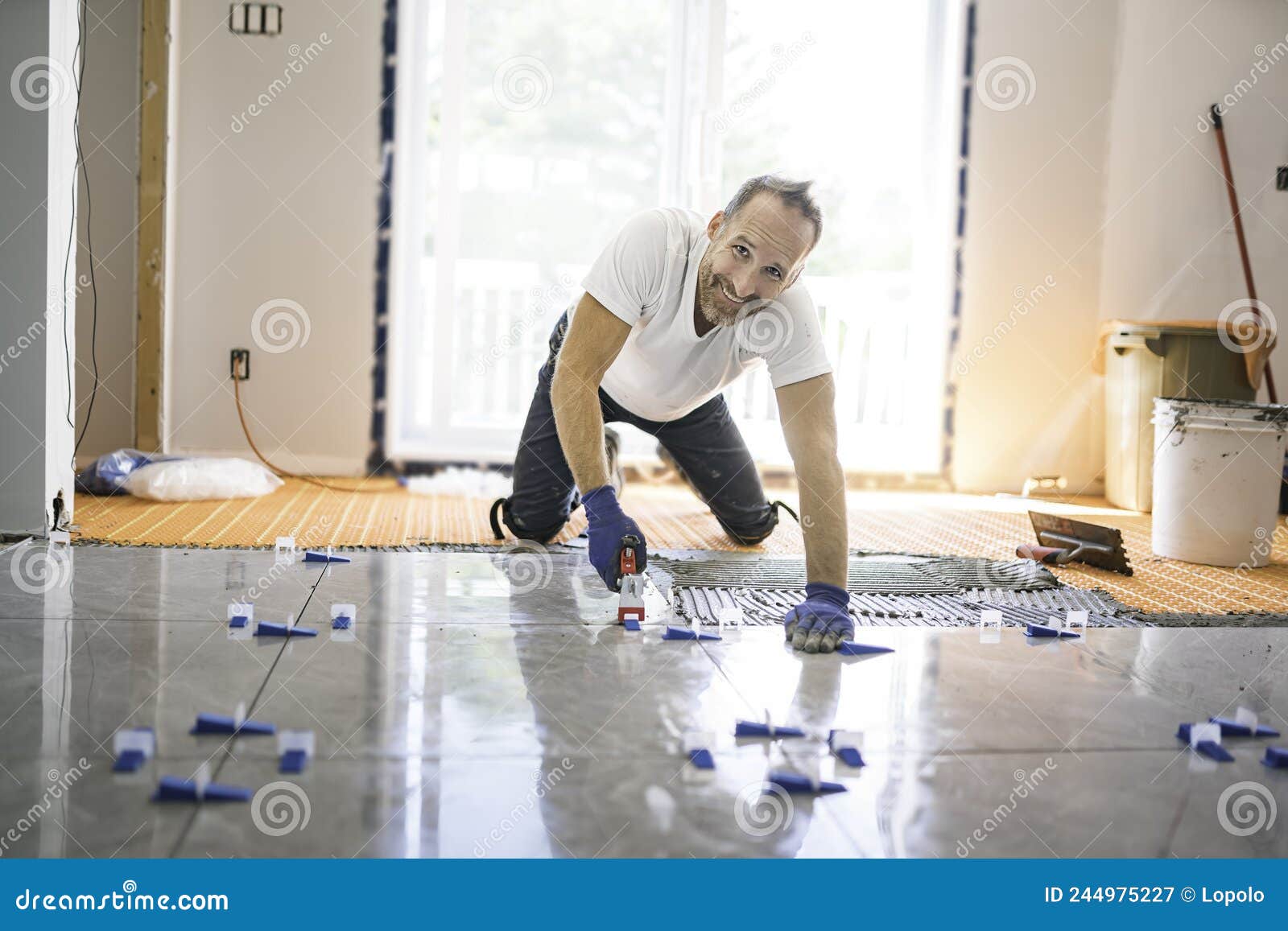 Nice Handyman Install Tile on the Floor Stock Image Image of
